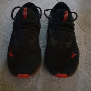Puma boys size 5.5, lightly used, good condition, black and red.